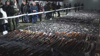 Serbians Surrender Guns, Rocket Launchers
