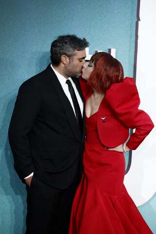 Lady Gaga Gives Nod To Harley Quinn, Romances Michael Polanksy On Red Carpet